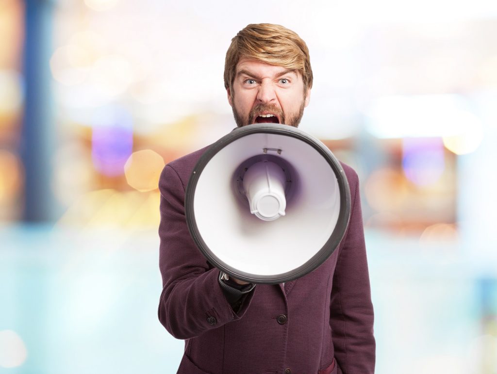 angry businessman with megaphone